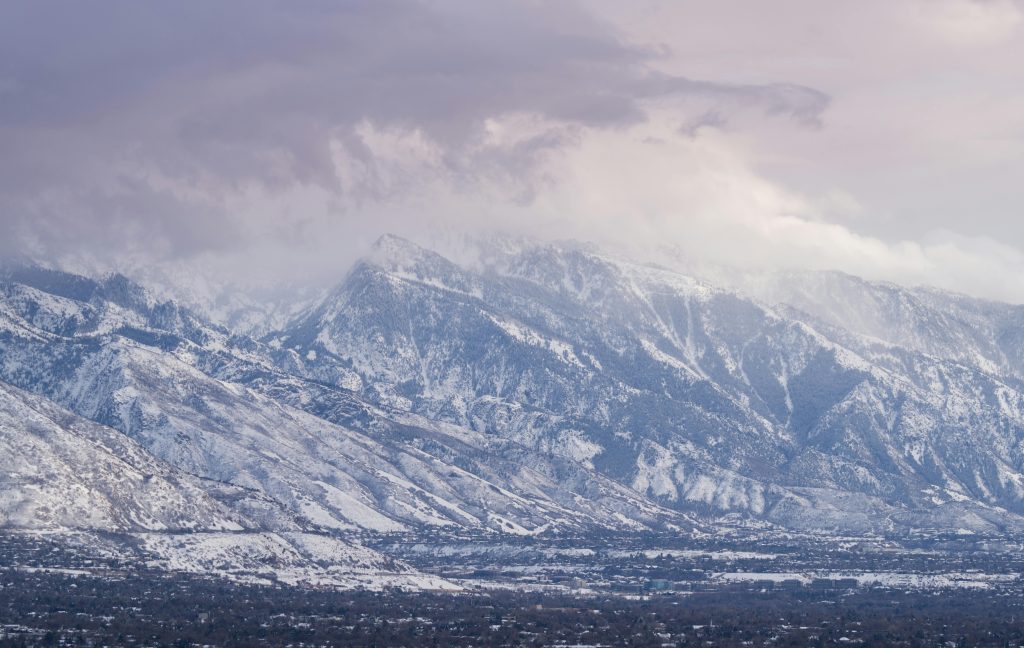 Serene winter view of the Wasatch Mountains with snow-covered peaks in Salt Lake City, Utah.